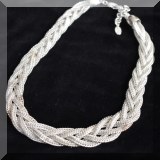 J12. Braided silvertone costume necklace. 